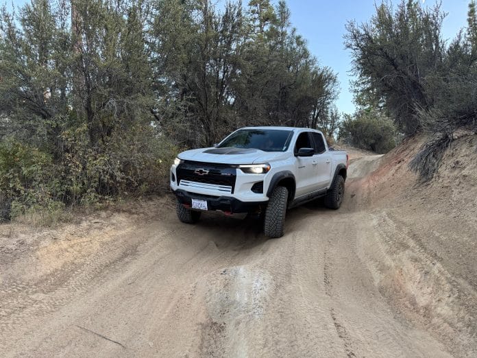 2025 Chevy Colorado driving down a dirt road offroad