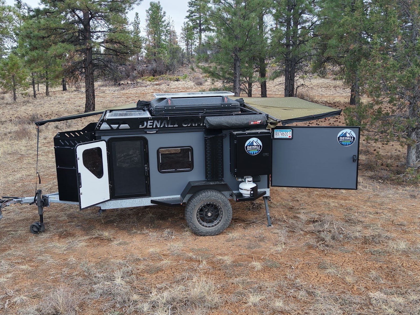 denali campers xtr-10 at camp with doors ajar