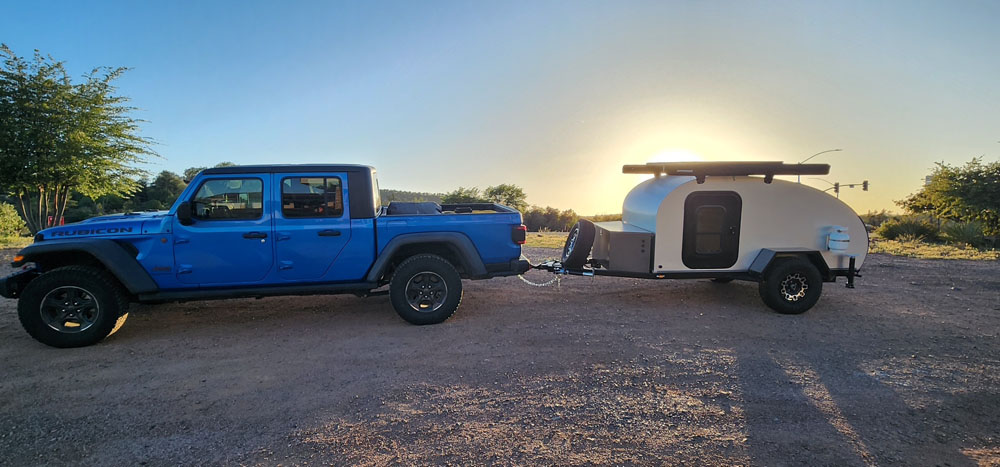 roadrunner with jeep at sunrise