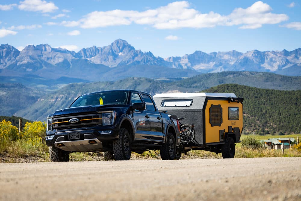 bean squared with ford in front of mountains