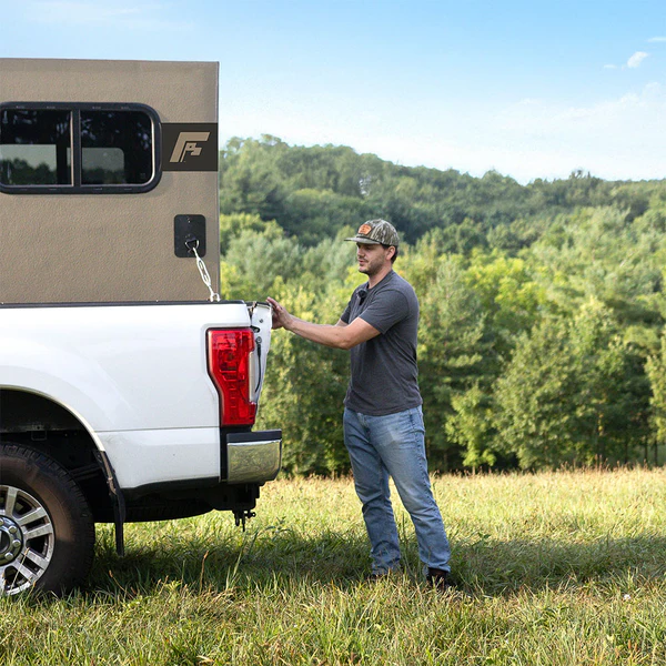 freedom camper on white truck with man