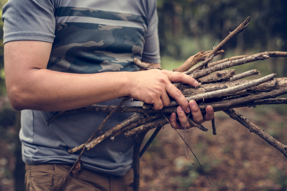 man collecting firewood