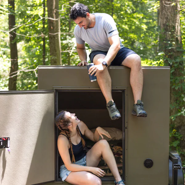 couple enjoying a freedom camper