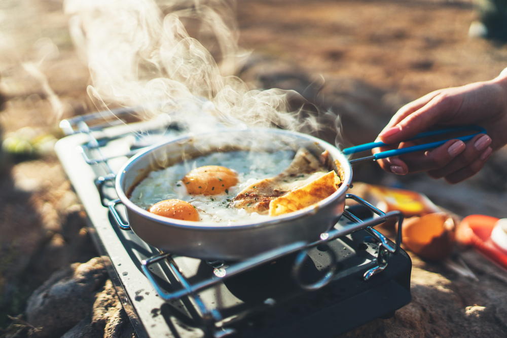 Cooking fried eggs on a camp stove