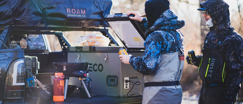 Two men using a ICECO VL60 while camping