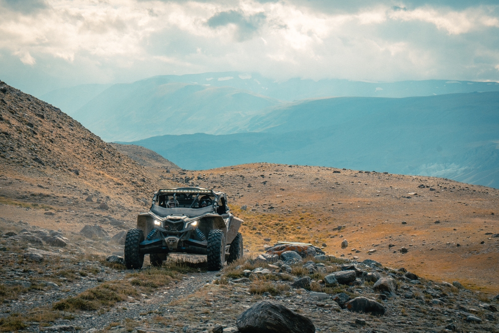 Off-road vehicles driving on a dirt road