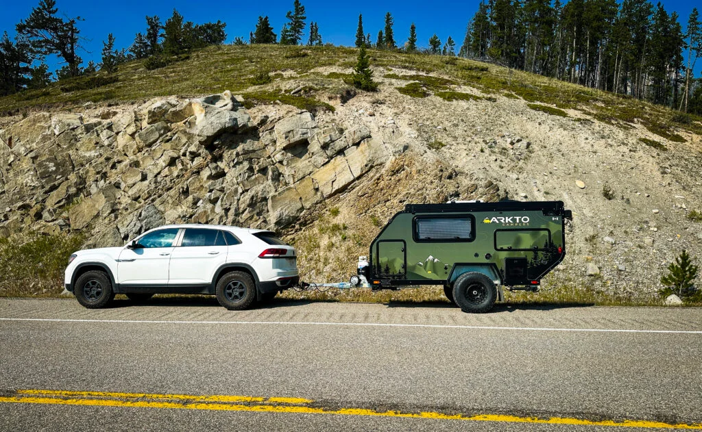 arkto c10 being towed by white suv