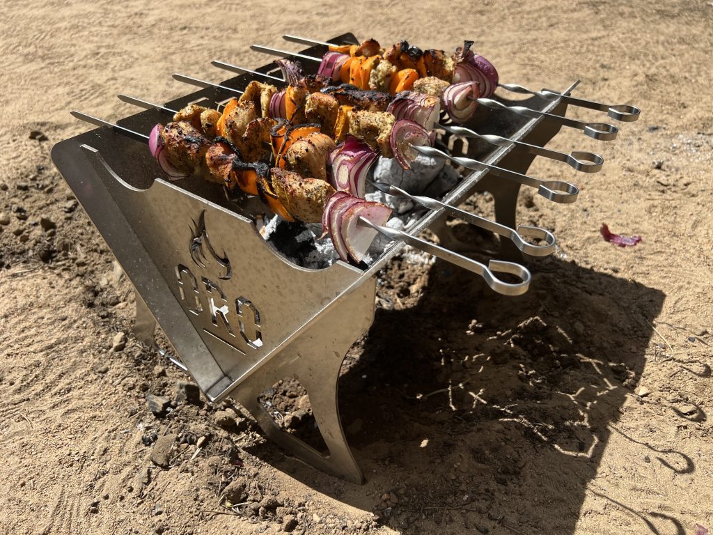 skewer cooking over wood coals in