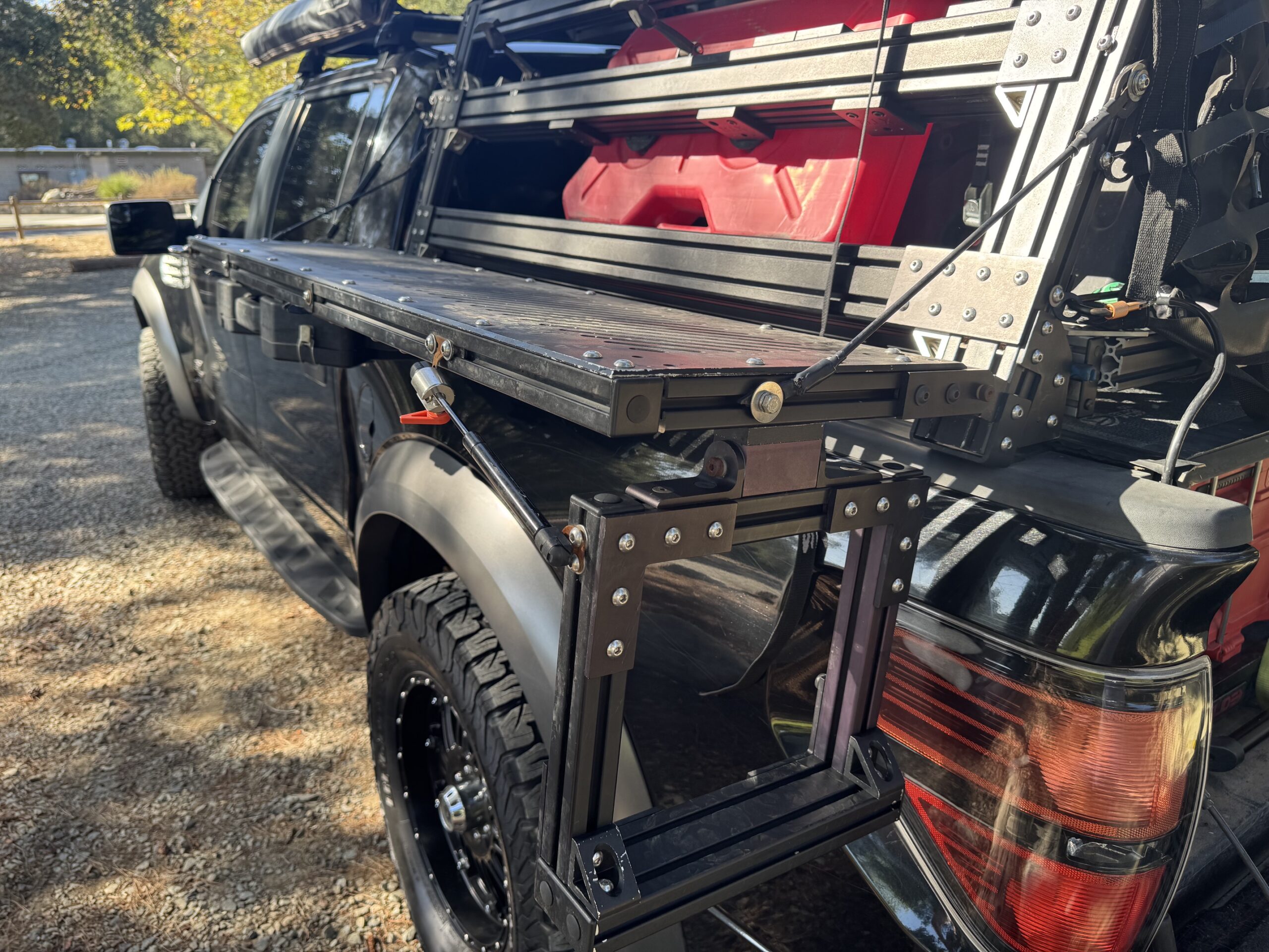 Yassa step deployed on the side of a Ford Raptor.