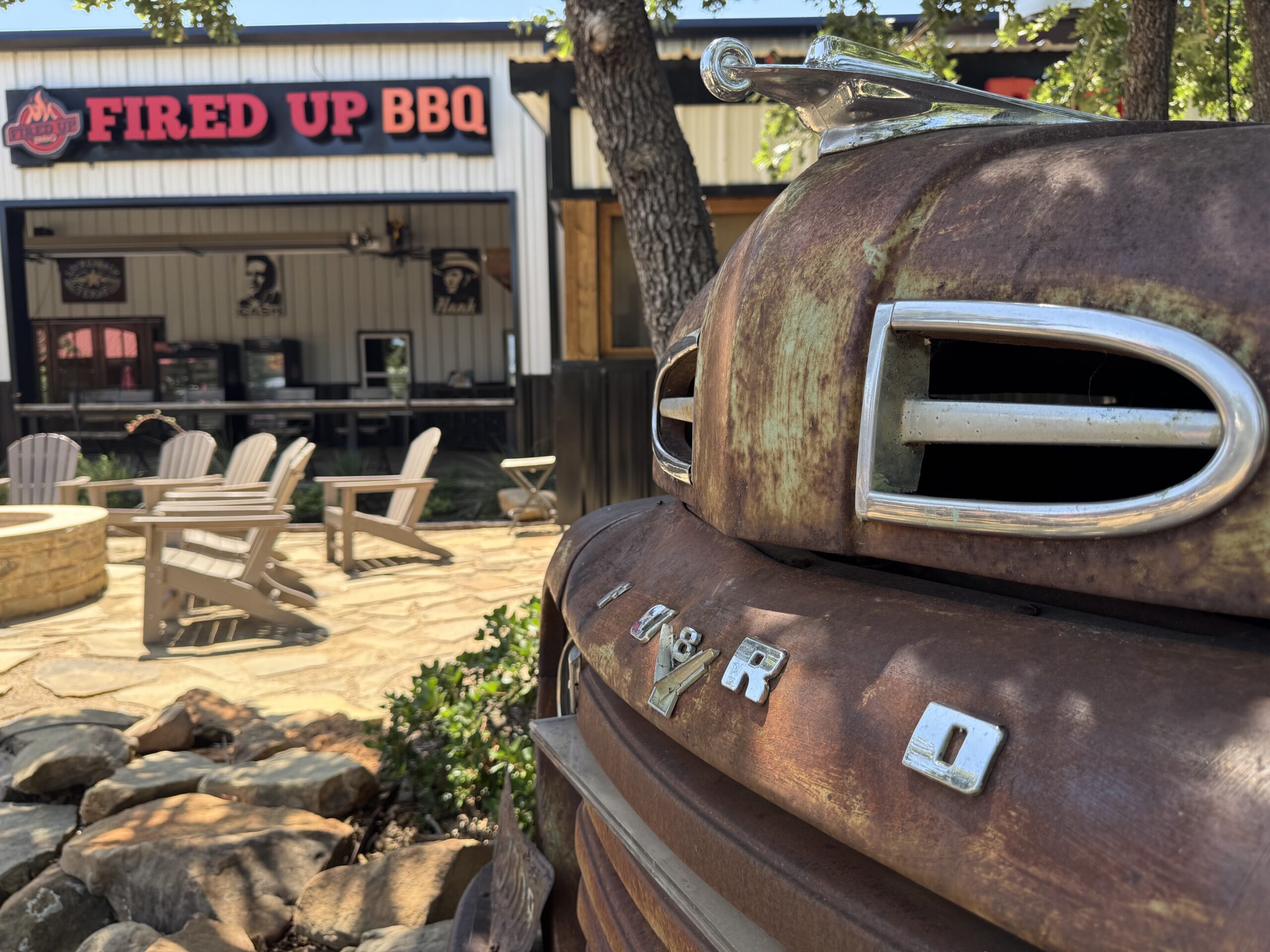 An old Ford pickup is one of the design props in the common area overlooking the barbecue house.