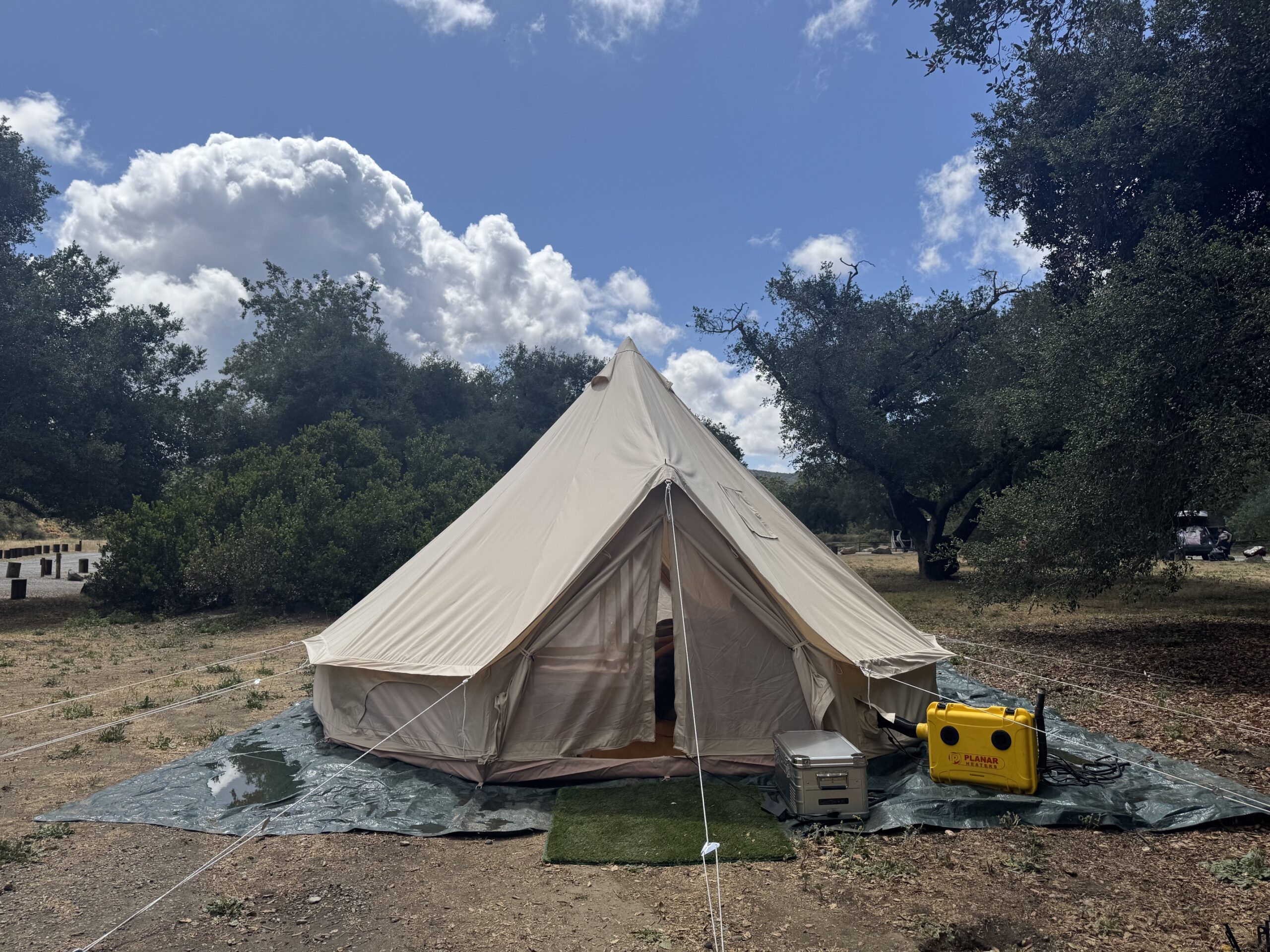 yellow diesel heater drying a Stout 5M Bell Tent after rain to prevent bell tent mold