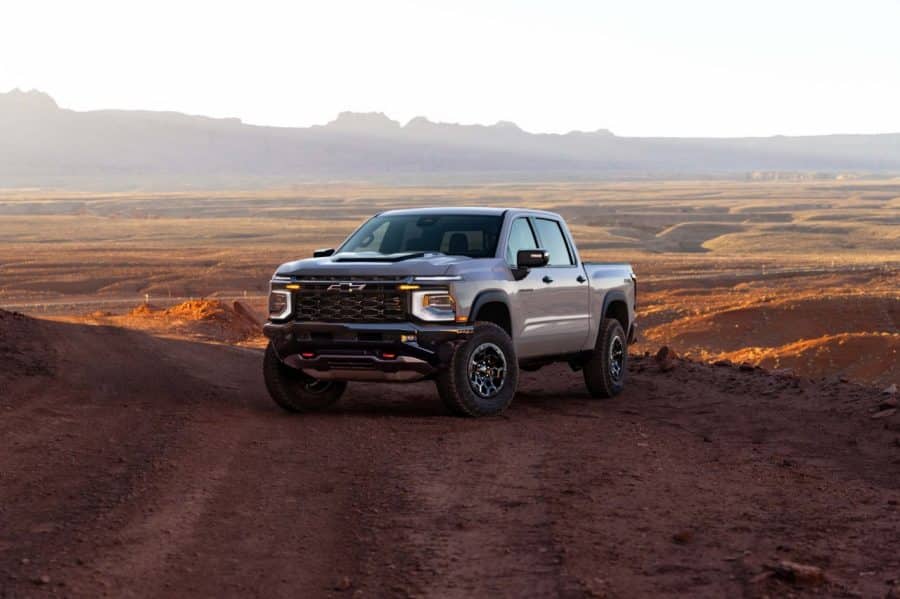 Chevrolet Silverado 1500 ZR2 in White Sands, driver-side front three-quarter in the desert