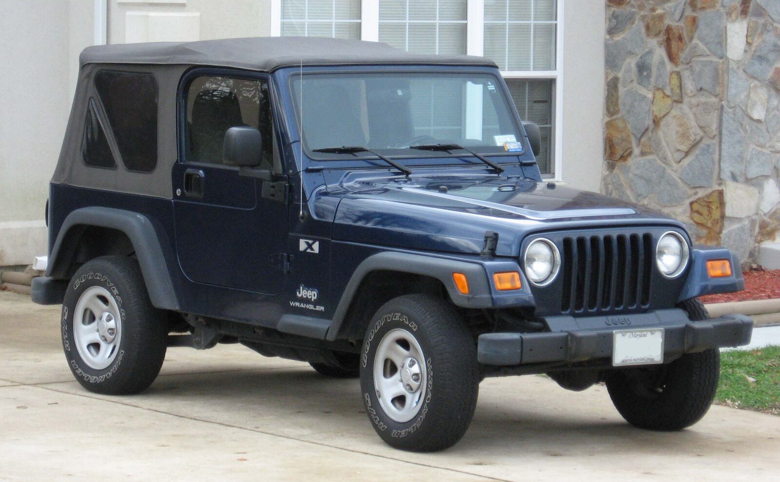 Jeep Wrangler TJ TJ-generation model with round headlights and coil-spring suspension