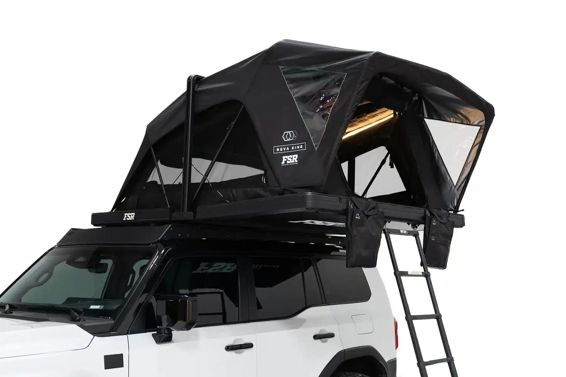 Freespirit Recreation Nova King rooftop tent with interior LED lights on at night