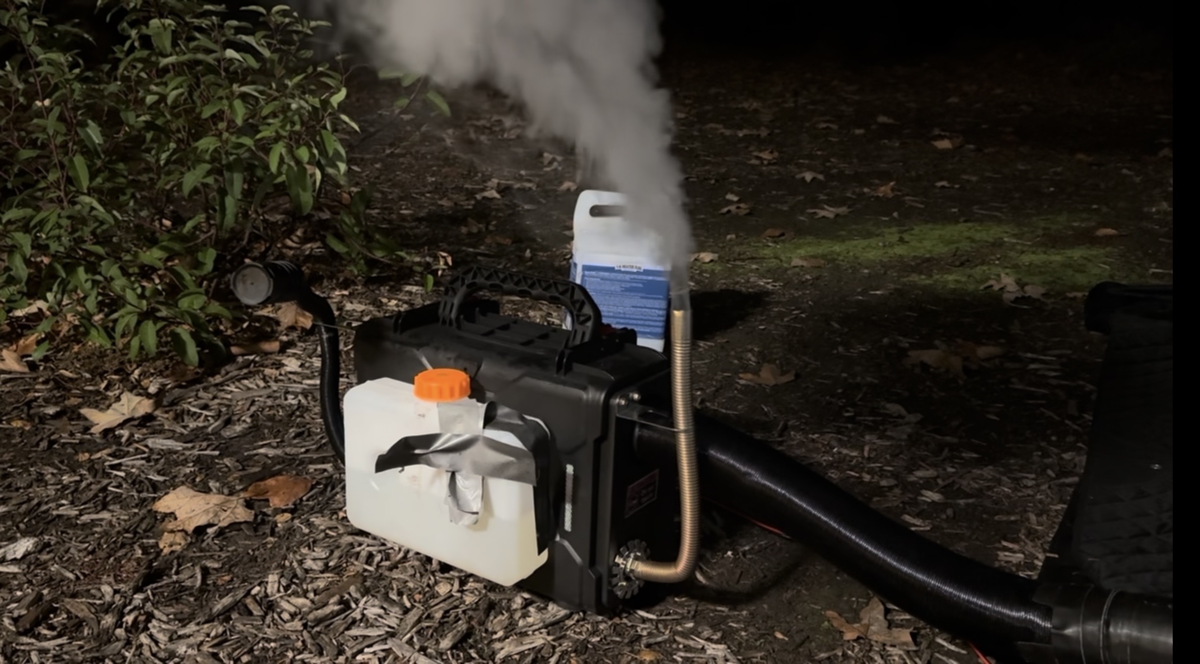 Hcalory Diesel Heater running with a lot of smoke coming out of its exhaust during review.