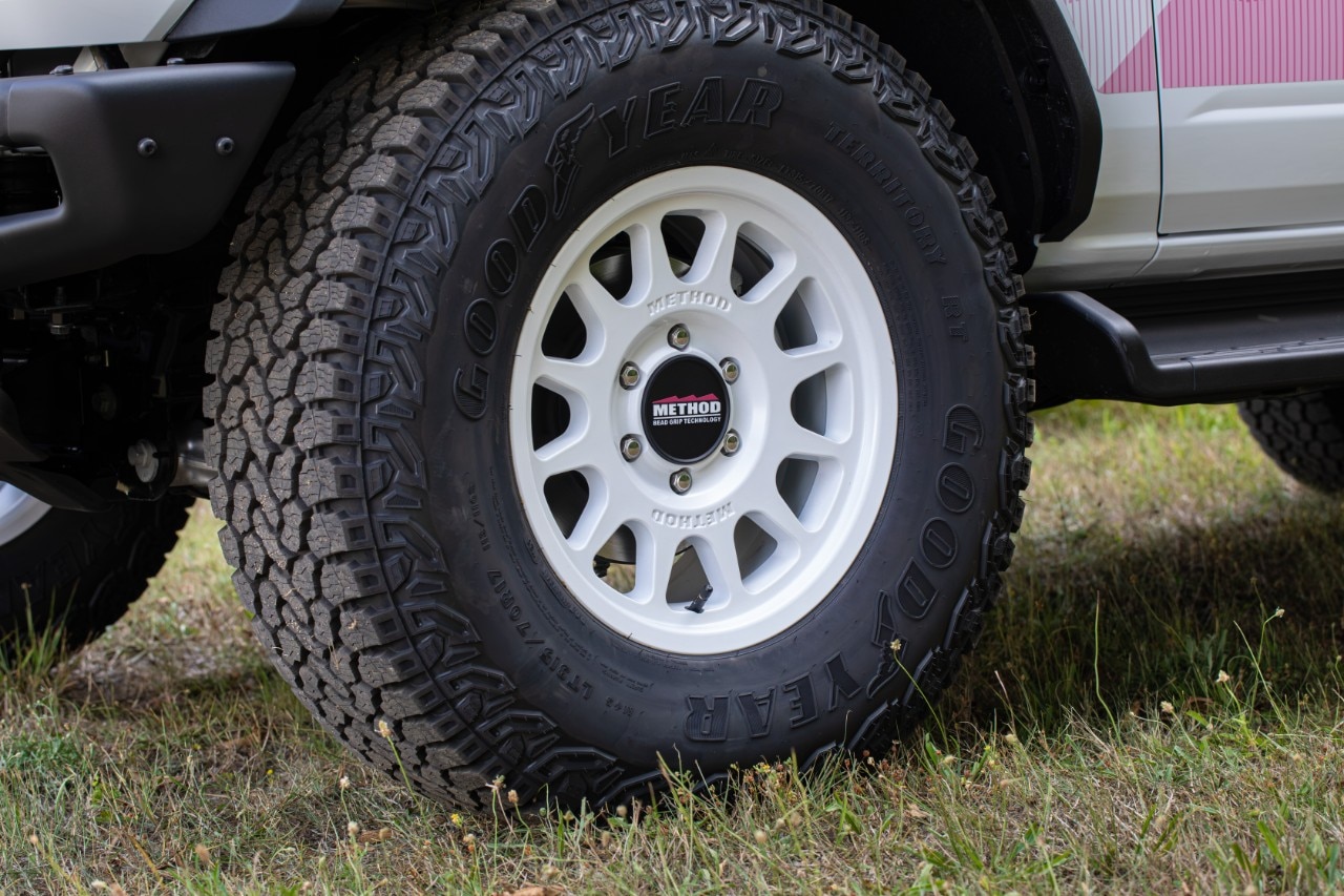 White 17-inch Method wheel with a Goodyear all-terrain tire on a Ford Bronco Desert Rising