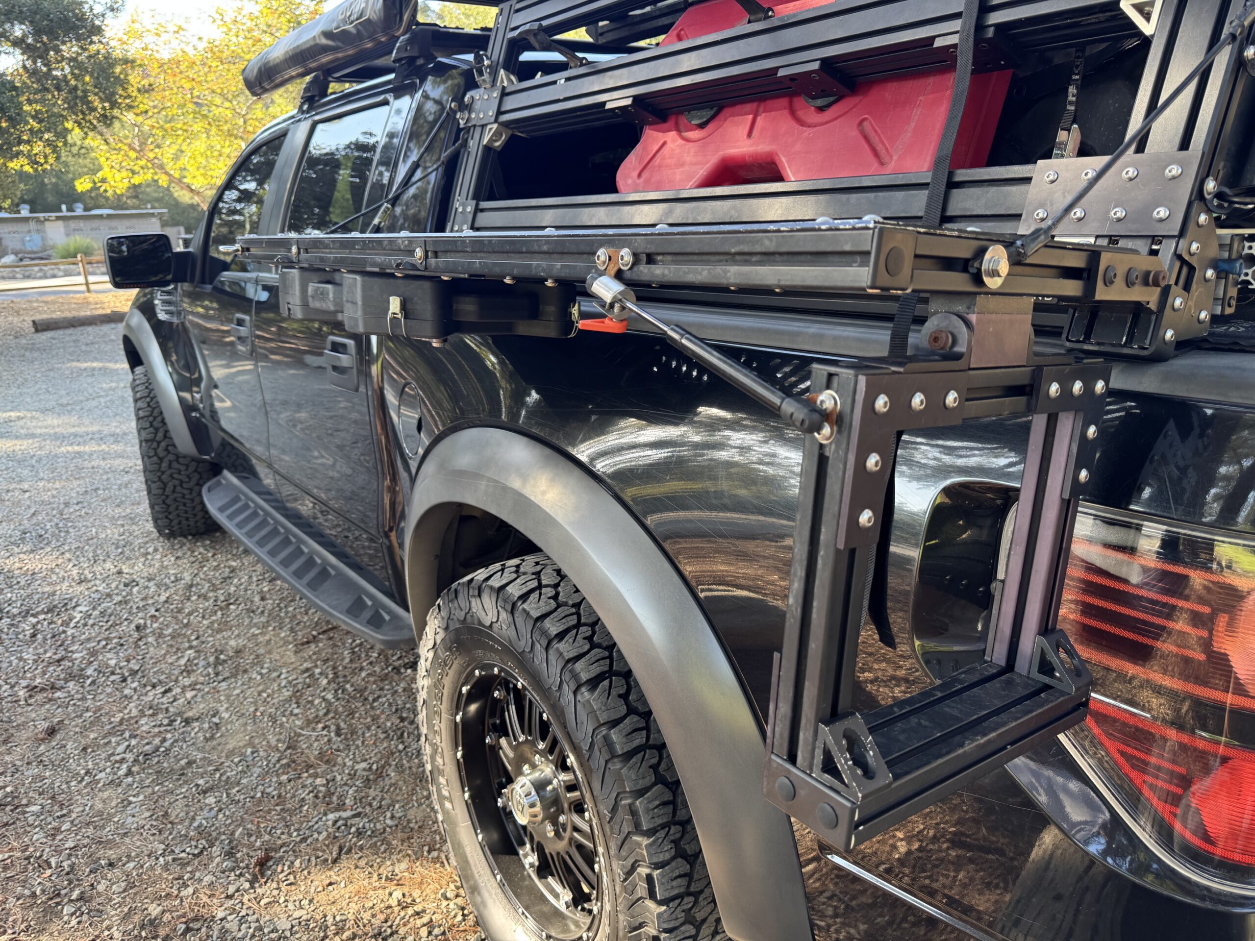 YASSA STEP deployed on the side of a 2013 Ford Raptor. 
