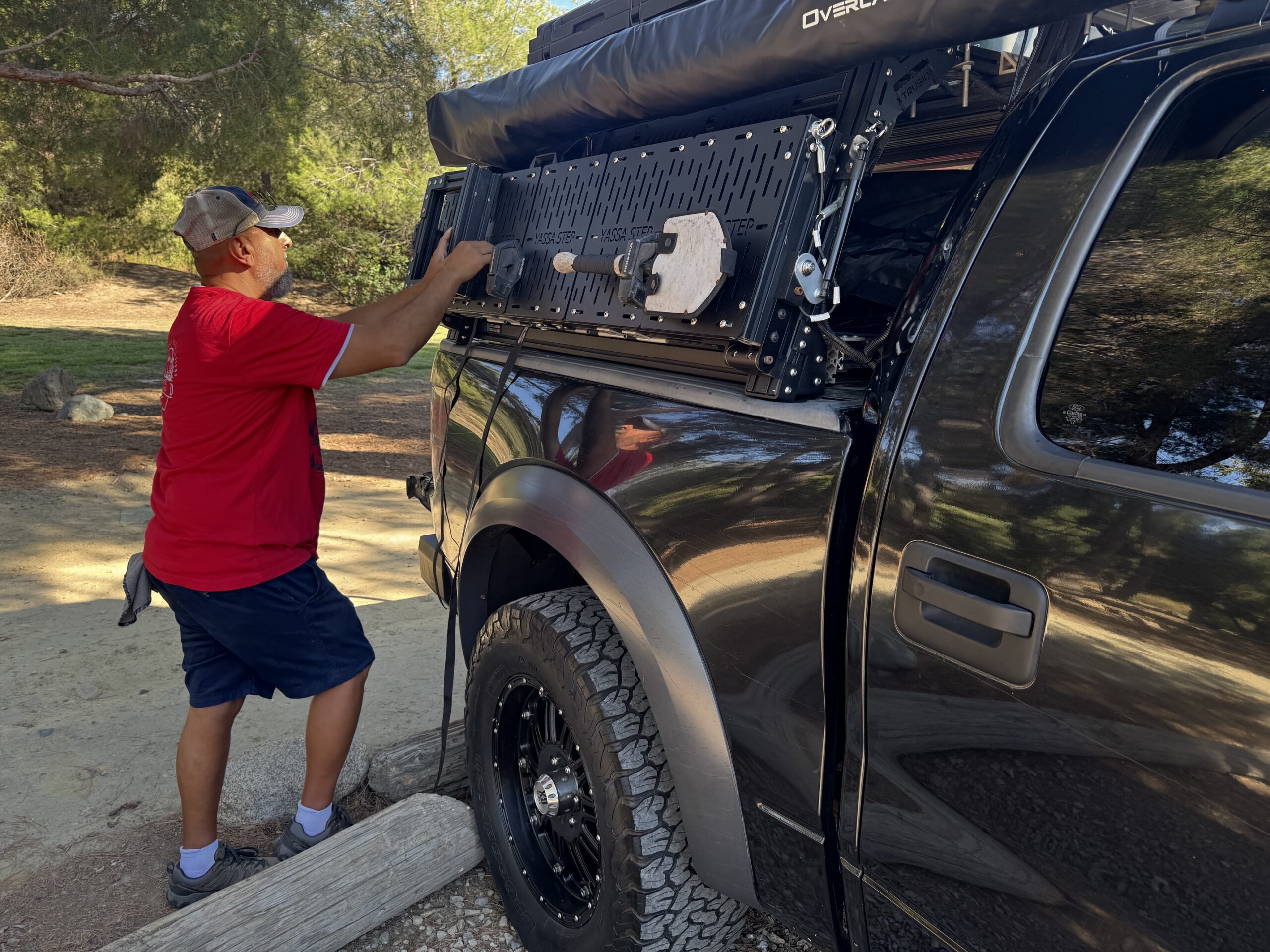 YASSA STEP installed on 2013 Ford Raptor. Passenger side showing MOLLE panels with gear mounted on it 