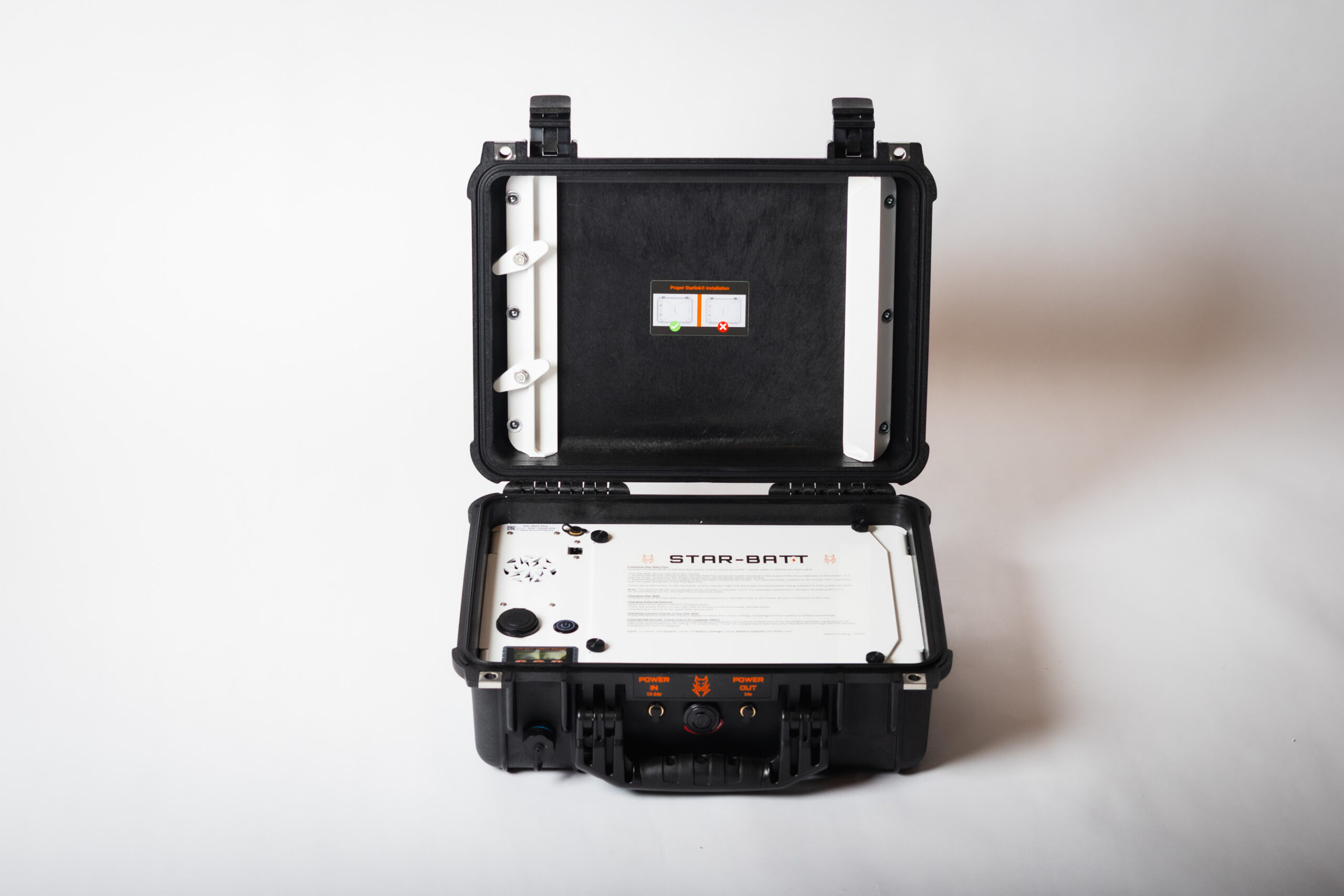 Open Star-Batt Plus case showing the Starlink Mini installation guide and control panel