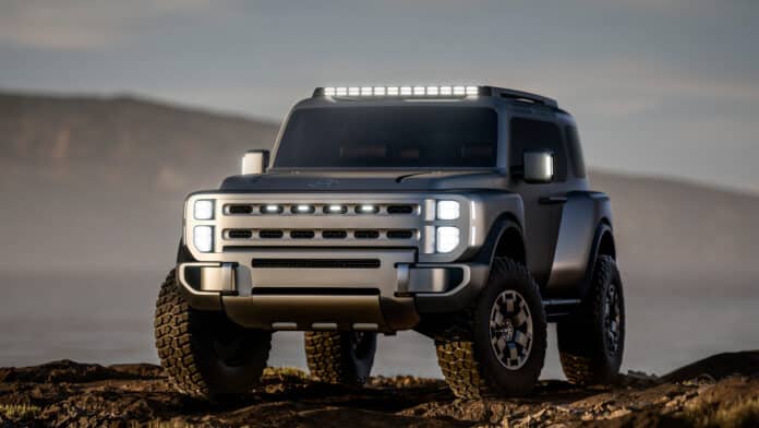 Hyundai Boulder concept off-road SUV on 37-inch mud-terrain tires, front three-quarter view on a rocky ridge at dusk