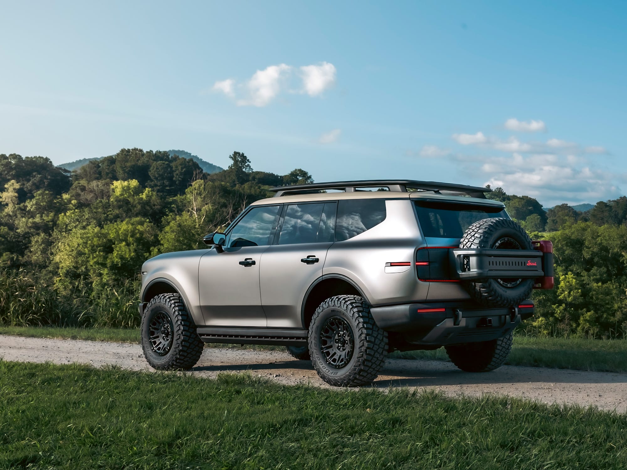 Scout Traveler concept trail-ready build in Galvanized Steel paint on 35-inch tires with a rear spare carrier