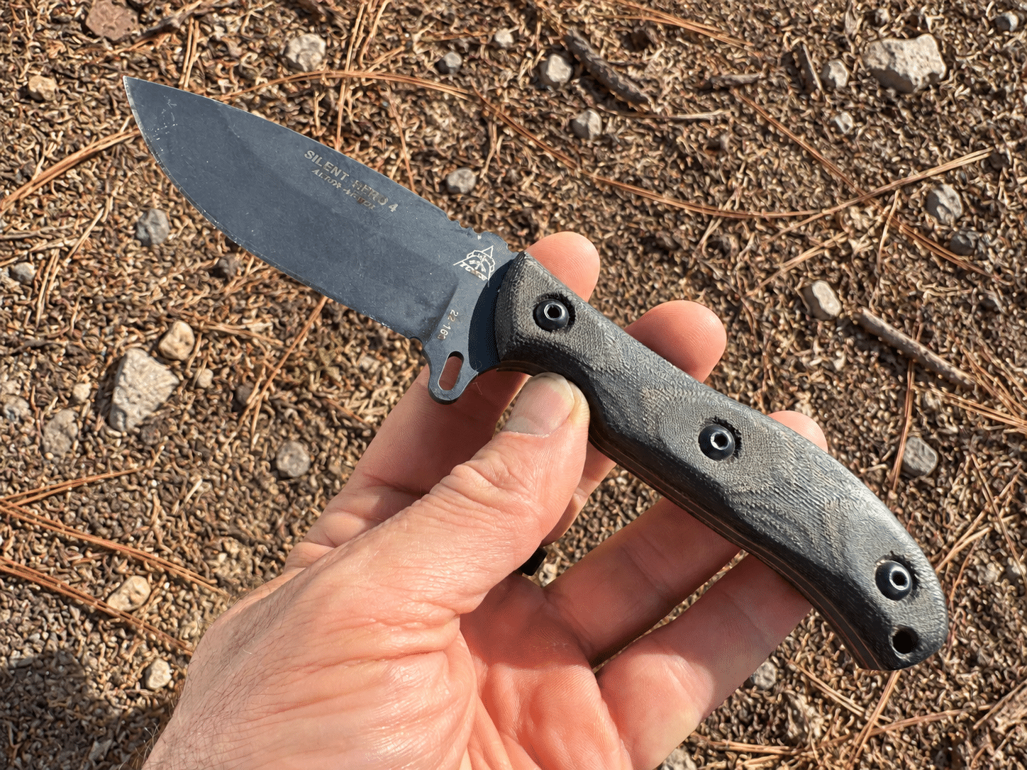 Silent Hero Knife over forest ground
