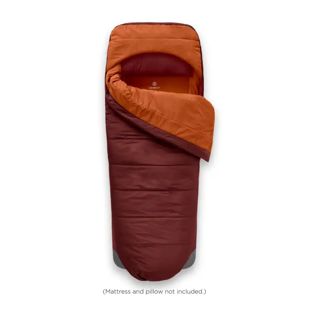 Zenbivy Overland ZipBed camping sleep system with the quilt clipped to its fitted sheet