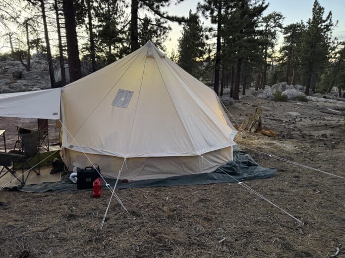 velit-portable-heater-camp-layout Velit portable heater and fuel can positioned outside a bell tent at camp