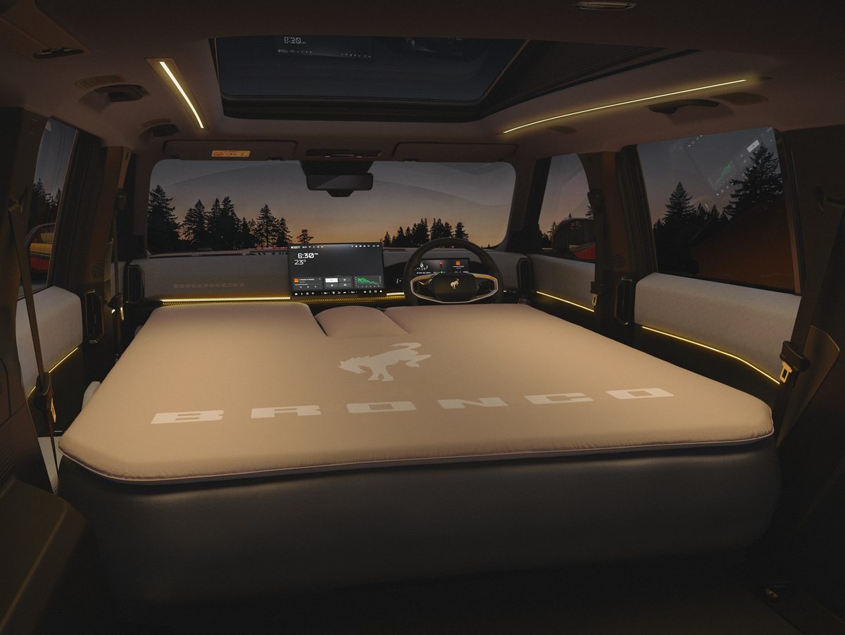 Bronco Basecamp cabin with both seat rows folded flat under an inflatable Bronco mattress
