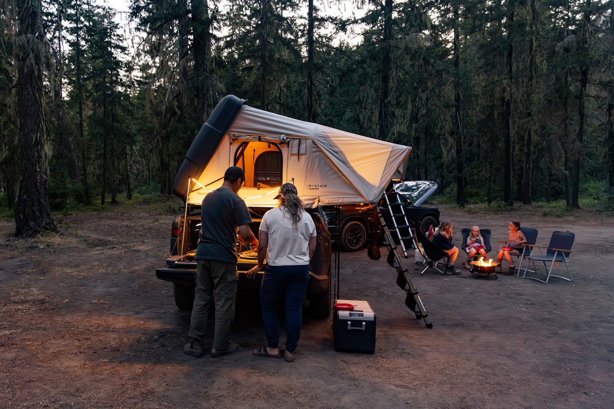Skycamp 4.0 DLX Duo open over an R1T bed at a campsite at dusk