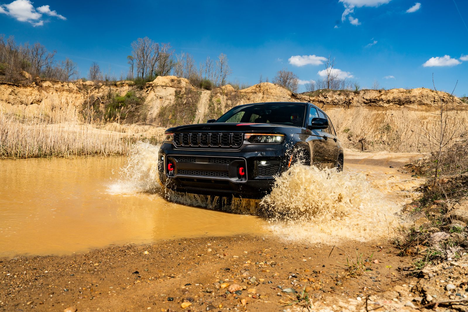 2027 Jeep Grand Cherokee Trailhawk fording water, a preview of the 2028 Jeep Grand Cherokee platform