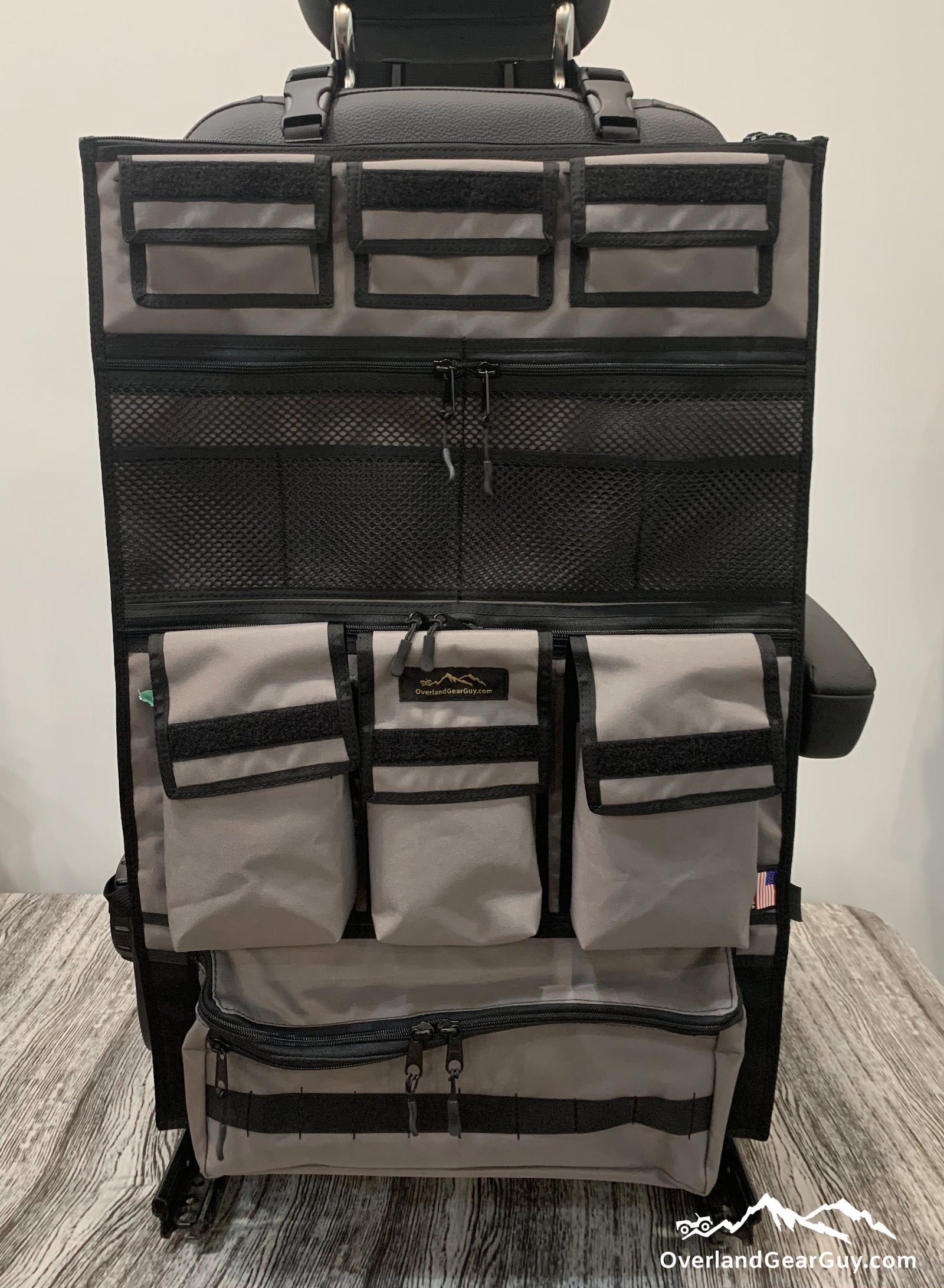 Gray Adventure Ready 3 Seat Organizer with a top zip pocket and three box pockets for Jeep Wrangler storage