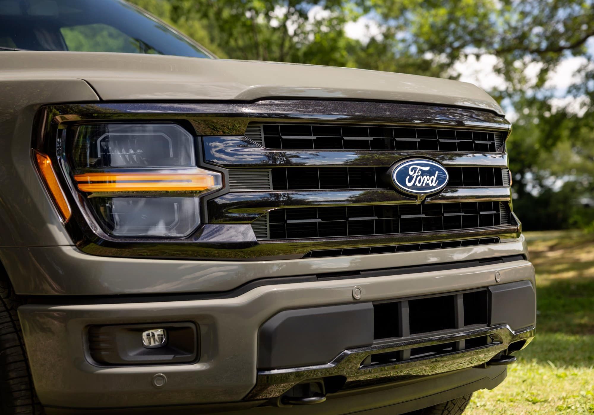 2027 Ford F-150 XLT Close-up of the new grille and headlight on the 2027 Ford F-150 XLT