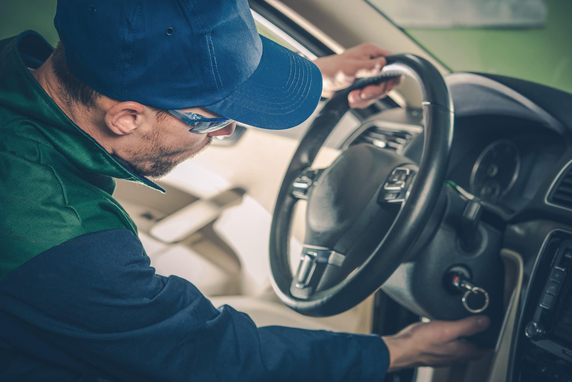 Recall service check at the dealer Service technician checking the dashboard and ignition of a vehicle during a recall repair
