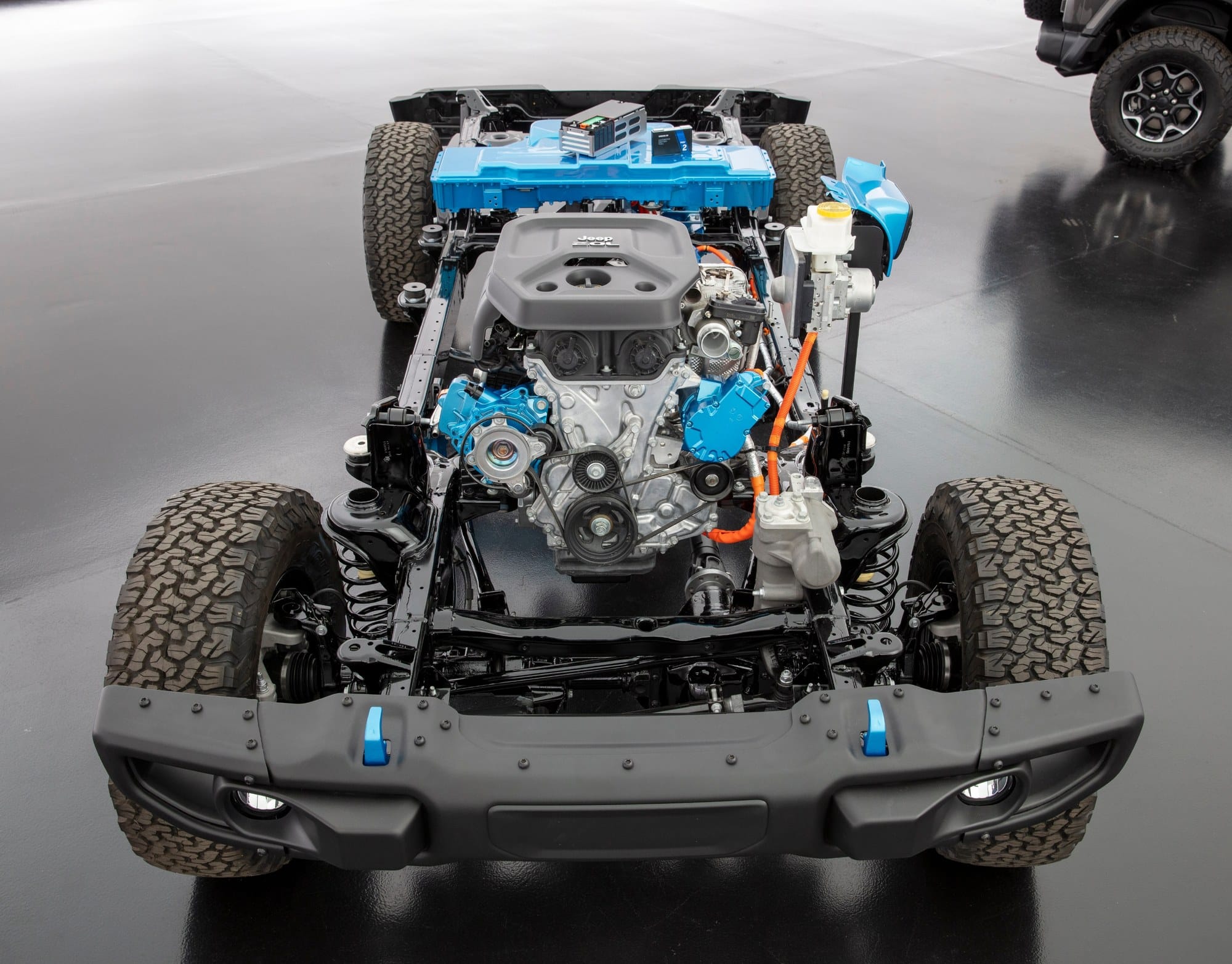 2024 Wrangler 4xe chassis showing the front axle and shocks checked in a Jeep Wrangler death wobble inspection
