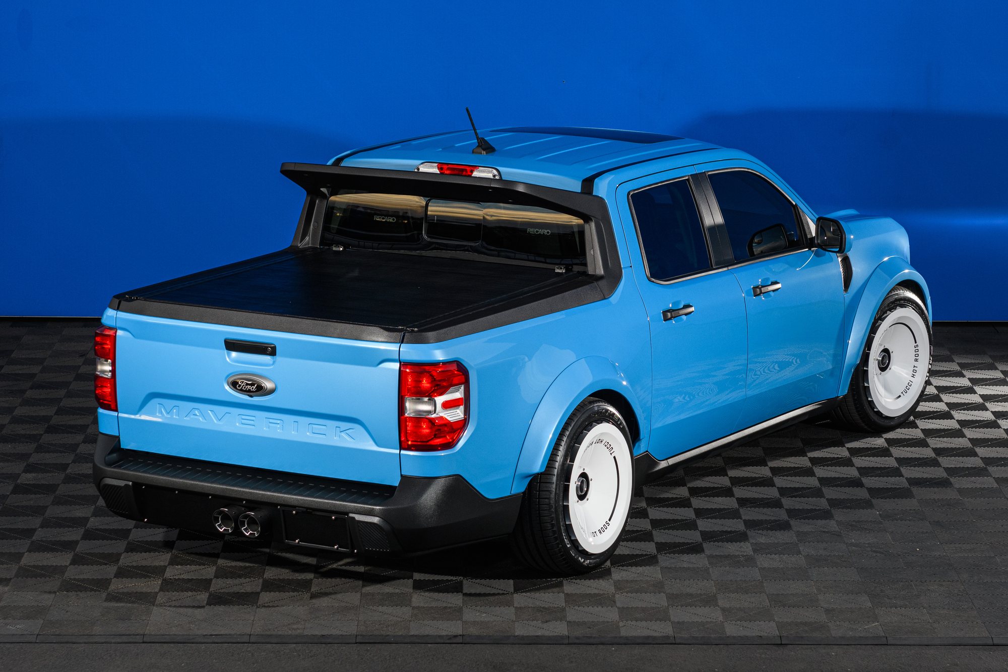 Tucci Hot Rods Ford Maverick V8, Rear Three-Quarter View Rear three-quarter view of the Tucci Hot Rods pickup with a hard tonneau cover, dual exhaust tips and Recaro seats visible through the rear glass