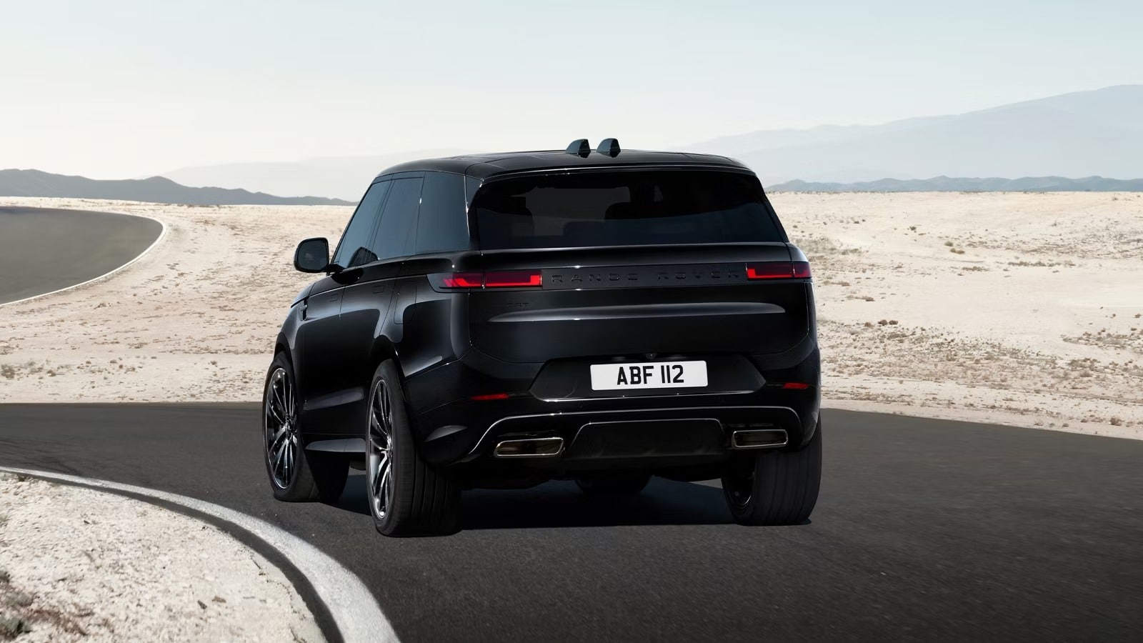 Range Rover Sport in Santorini Black Range Rover Sport in Santorini Black driving on a road