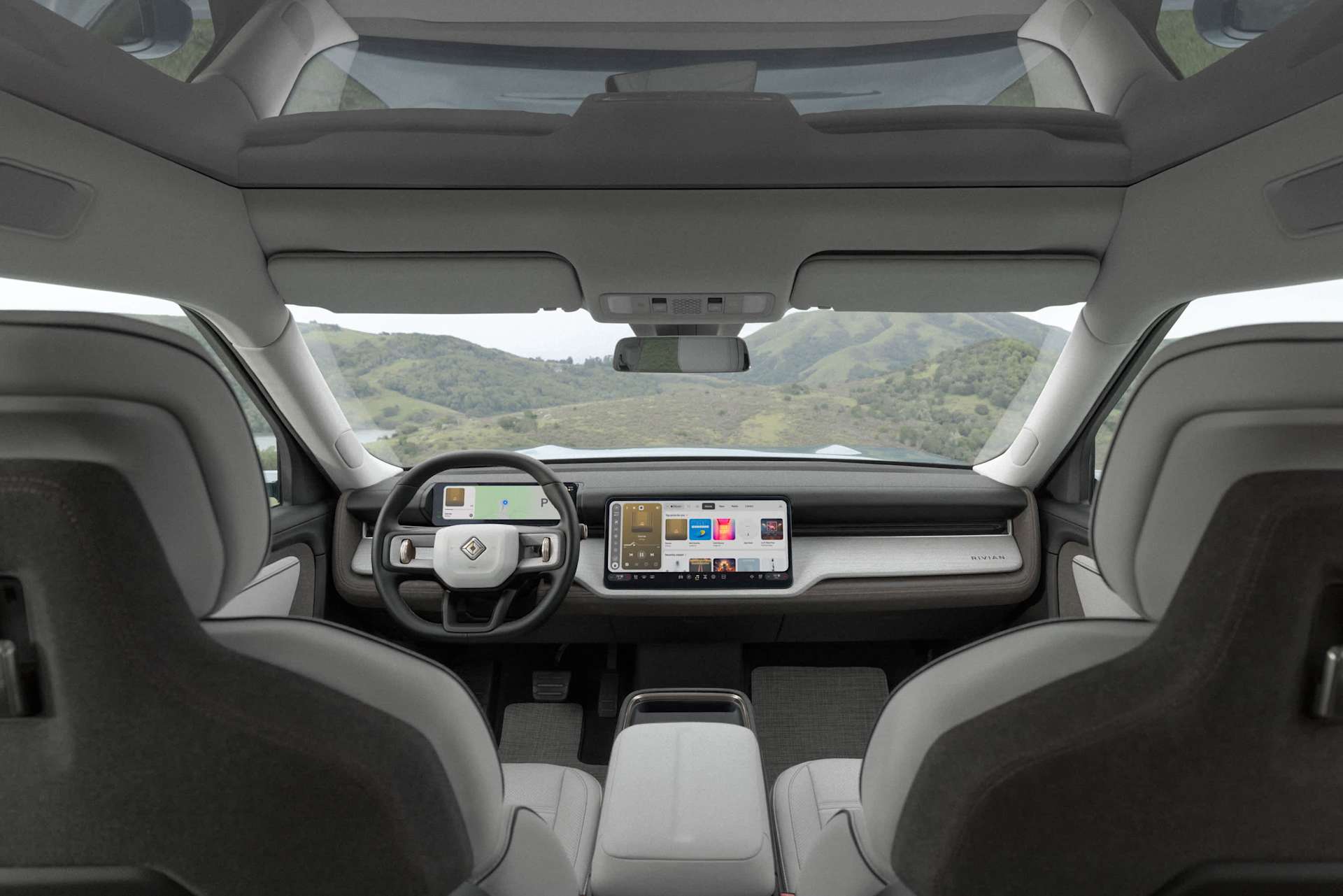 Rivian R2 interior Interior of a Rivian R2 showing the dashboard screens and steering wheel
