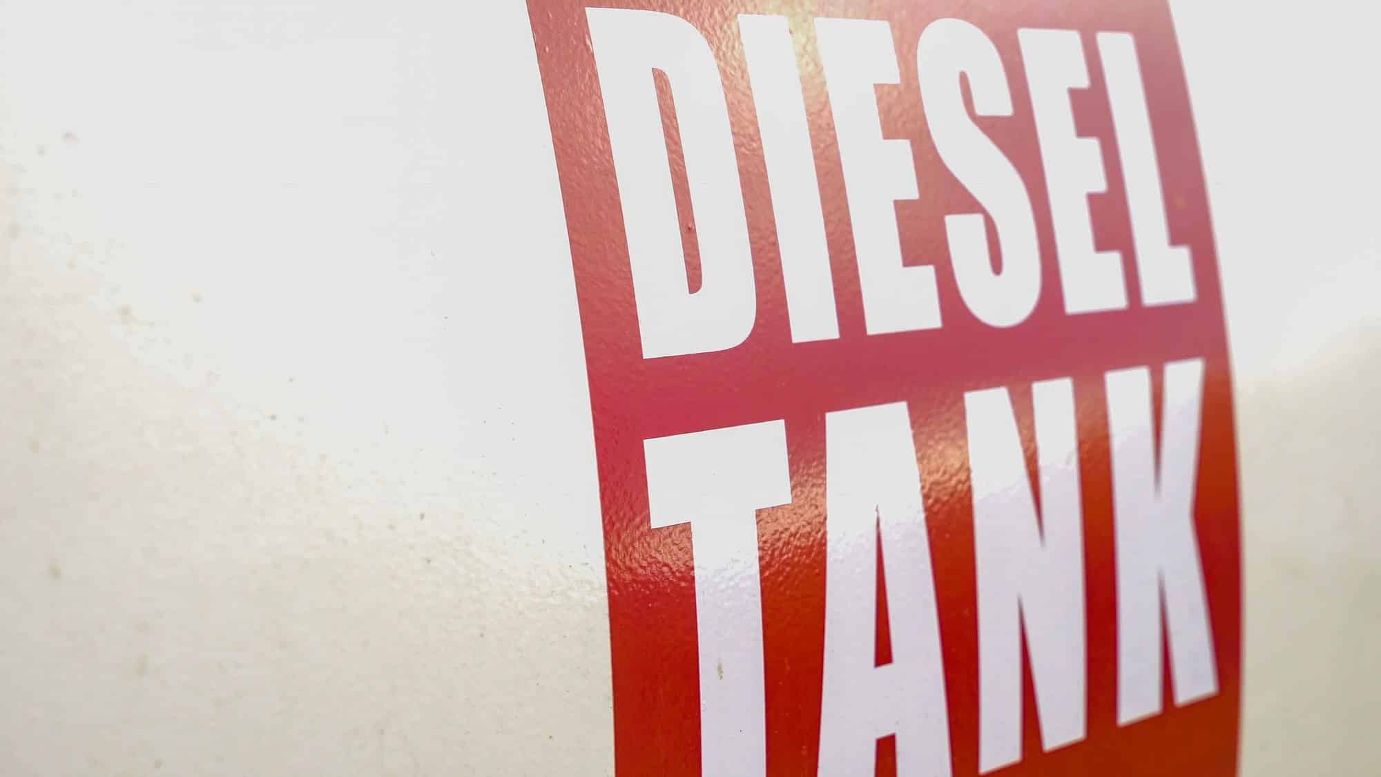 Farm diesel storage tank Red Diesel Tank label on a white farm fuel storage tank
