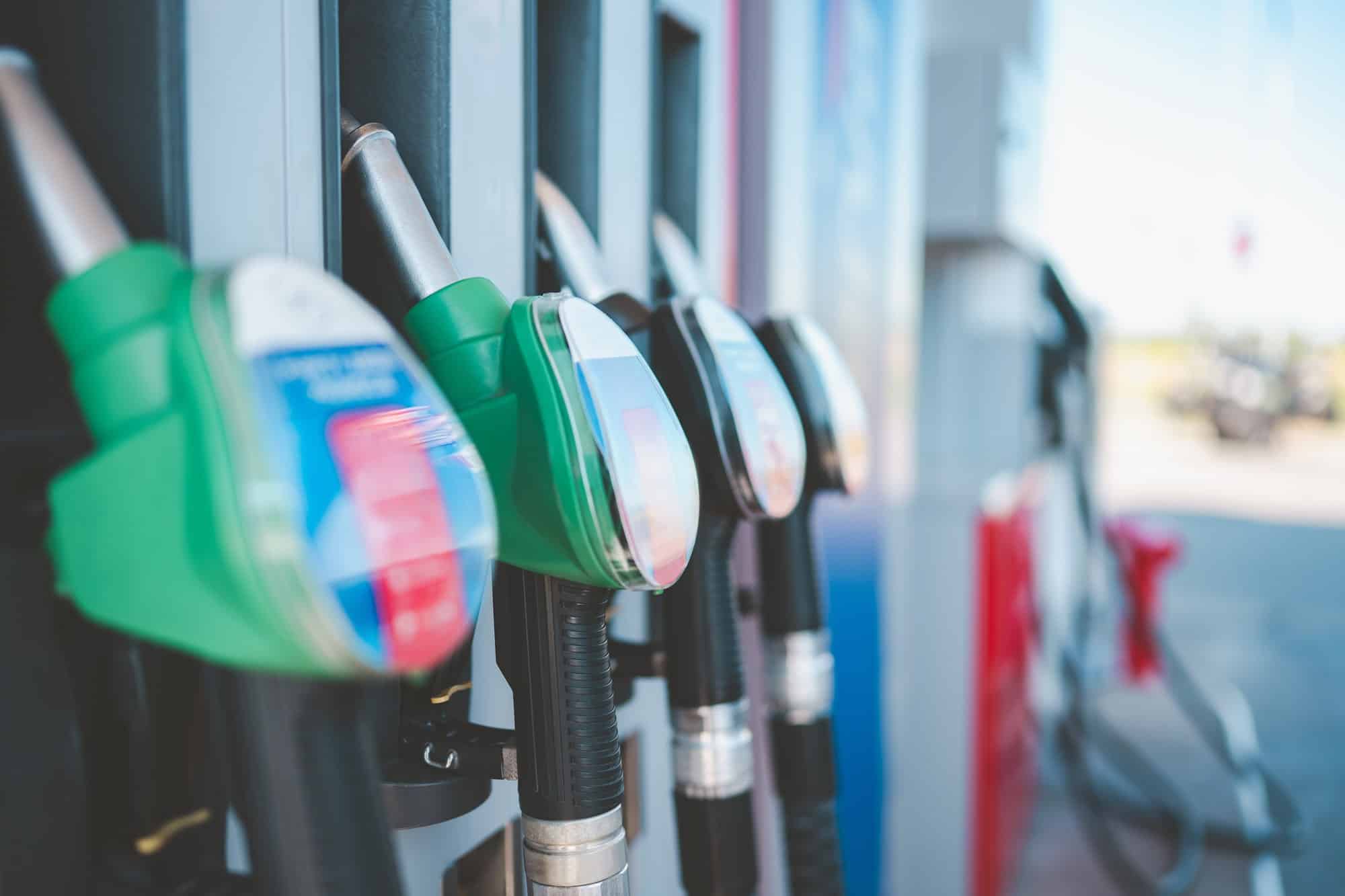 Diesel pump nozzles at a fuel station Diesel and gasoline pump nozzles at a fuel station