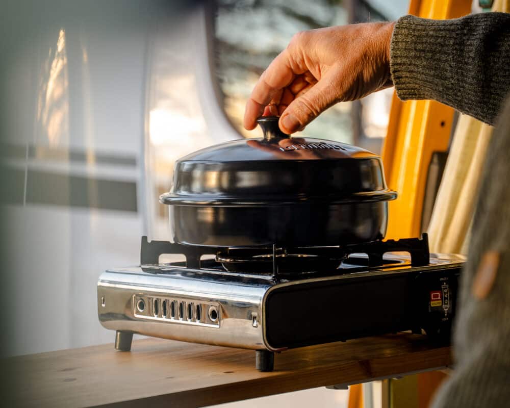 Omnia Stovetop Pizza Oven in use, Omnia press photo
