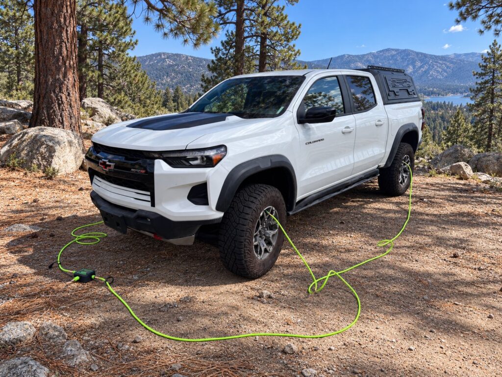 MORRFlate Air Hub Airing Down Four Tires MORRFlate Air Hub connected to a four-tire hose kit on a white pickup at a pine forest overlook