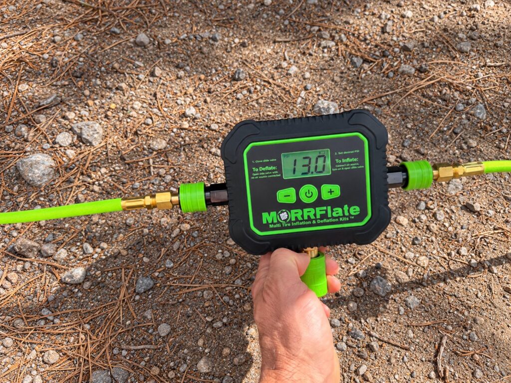 Air Hub Backlit PSI Display Air Hub backlit display reading 13.0 psi with braided hoses attached on both sides