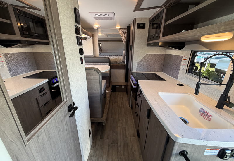 Lance 1191 Slide interior galley and dinette Lance 1191 Slide interior looking forward past the galley sink to the dinette