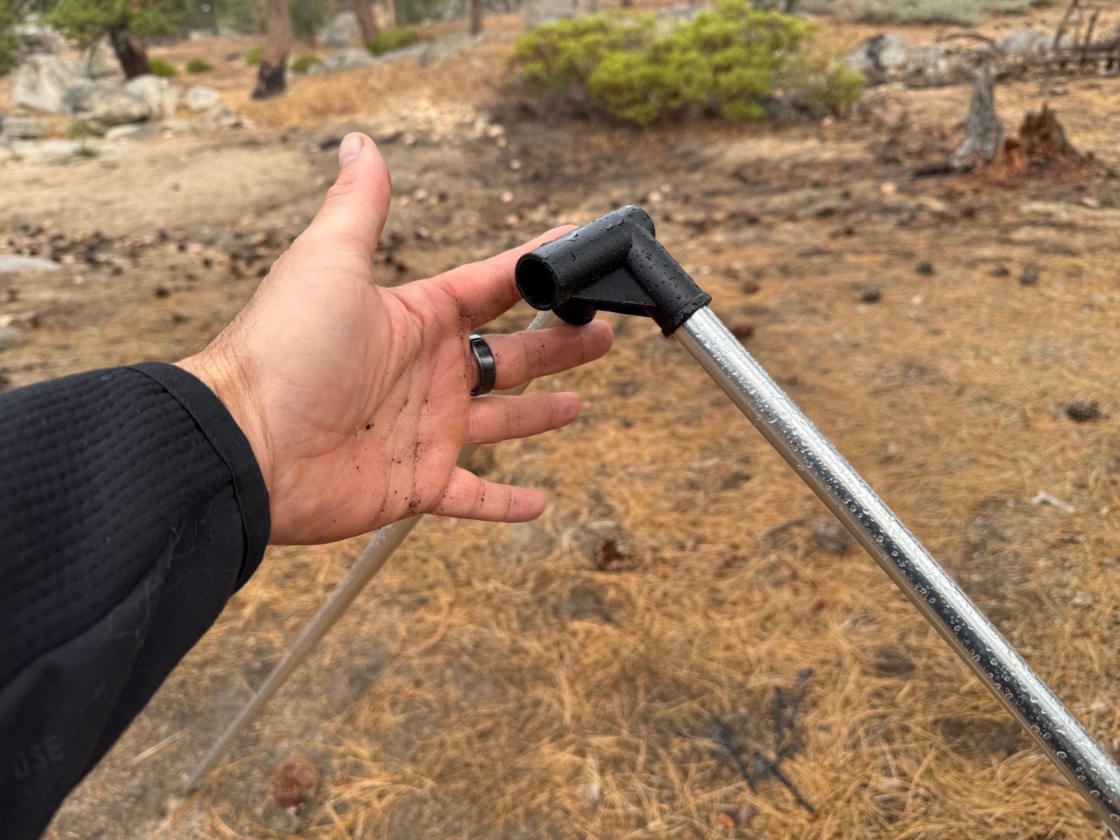 Sky View XL Frame Corner Connector Hand holding a Sky View XL corner connector at the top of a frame pole