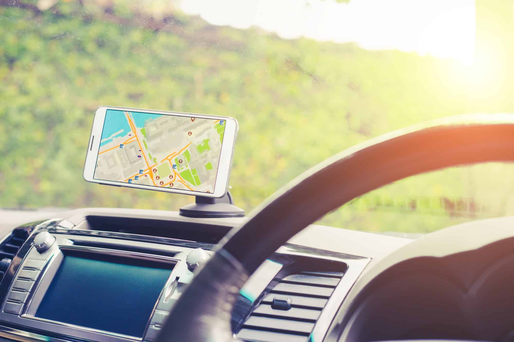 Phone trail map on dash mount Phone showing a map in a dashboard mount inside a vehicle