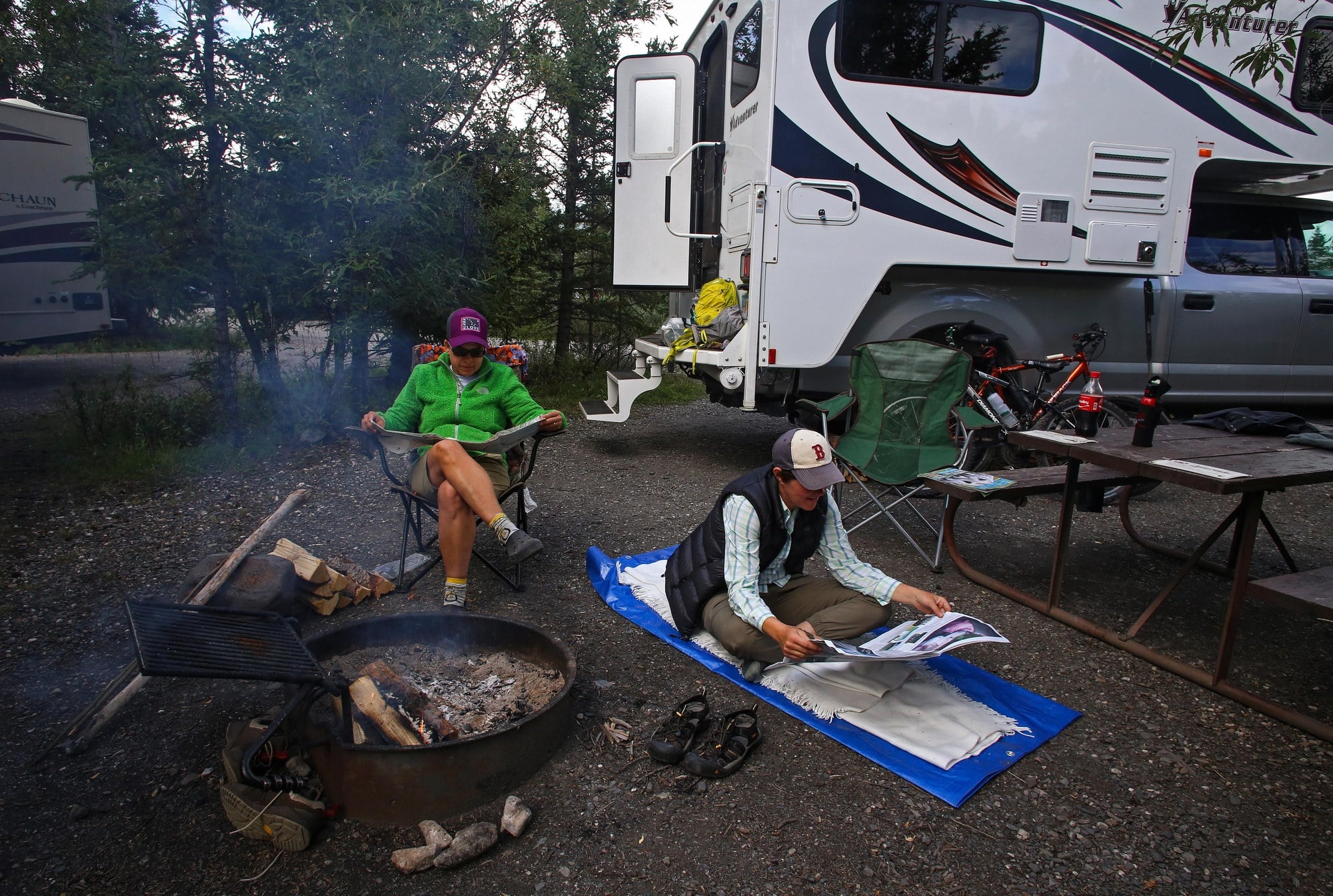 Teklanika Campground camp A truck with a cab-over camper at a campfire at Teklanika Campground in Denali