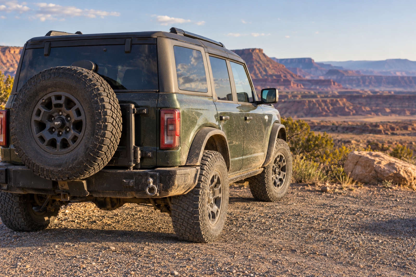 Carry a Matching Full-Size Spare Tire Dusty four-wheel-drive SUV with a full-size all-terrain spare matching its road tires