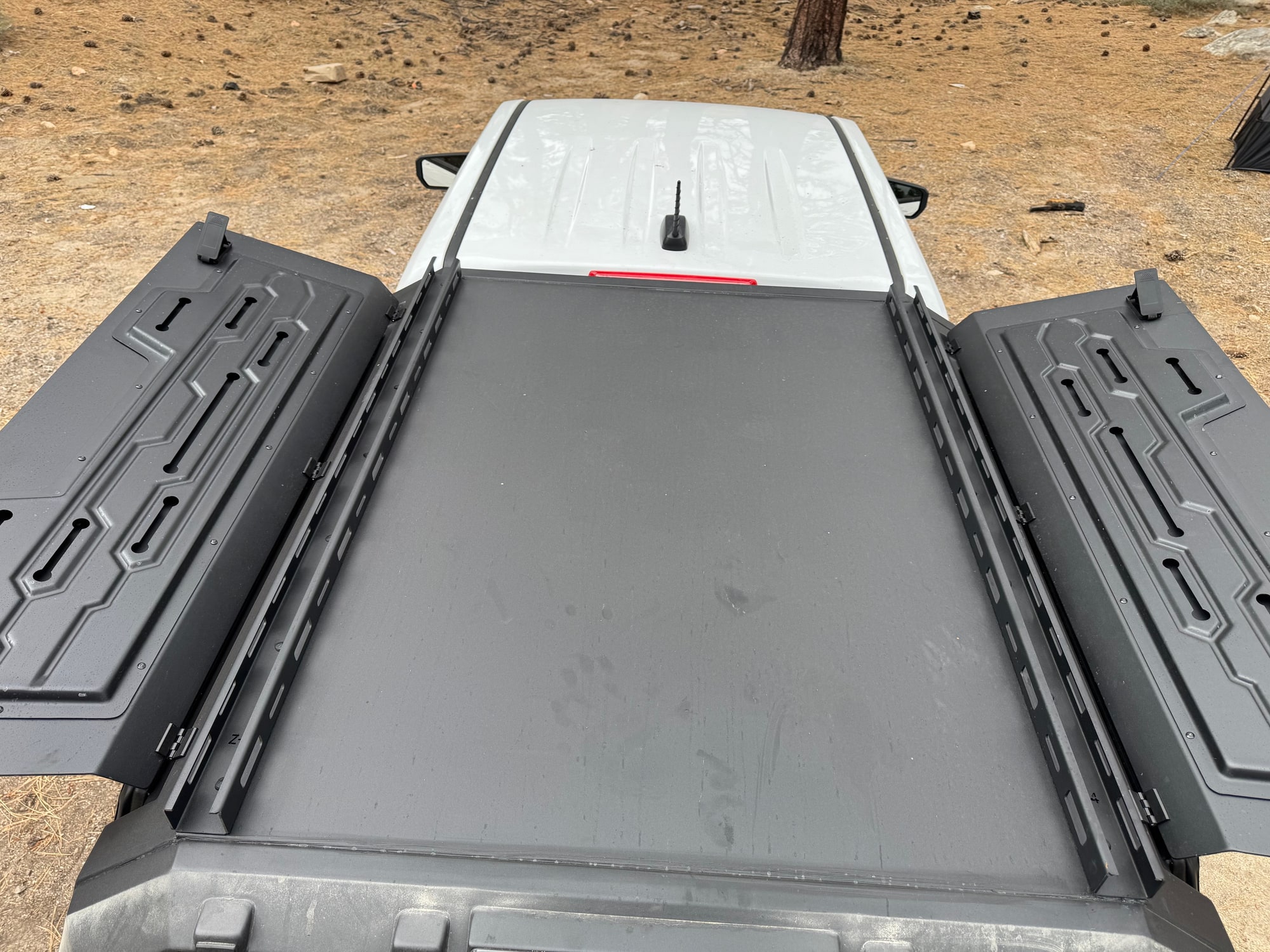 OPENROAD Truck Cap Roof and Rails from Above Overhead view of the OPENROAD truck cap roof and two roof rails, with both side doors raised and no crossbars fitted.