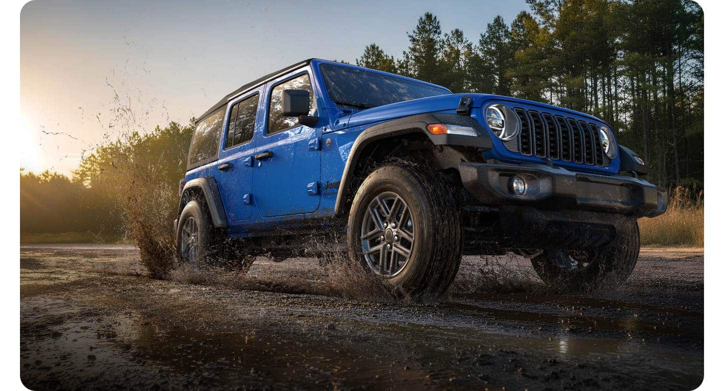 Blue Wrangler kicking up water on the trail in Jeep's 2027 design gallery